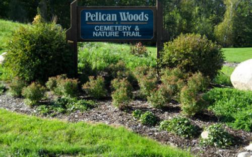 Entrance sign to Pelican Woods Cemetery