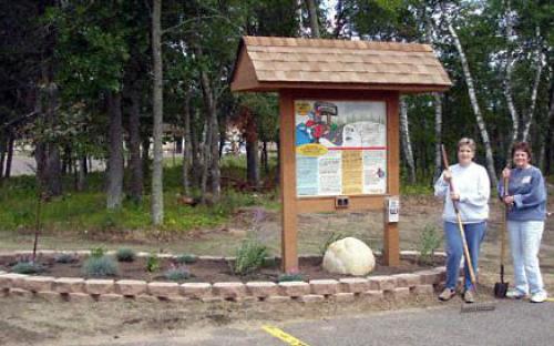 Interpretive Panel at park in Breezy Point is landscaped by local Master Gardeners.