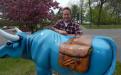 Babe the Blue Ox carries in his saddlebags garden vegetables you may find in a local community garden.
