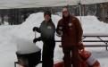 Stirring the soup cauldron with a canoe paddle is Ranger Corrine Hodapp (L) and ready to ladle soup is Krista Okerman (R)