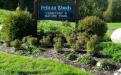 Entrance sign to Pelican Woods Cemetery