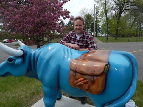 Babe the Blue Ox carries in his saddlebags garden vegetables you may find in a local community garden. Babe the Blue Ox carries in his saddlebags garden vegetables you may find in a local community garden.