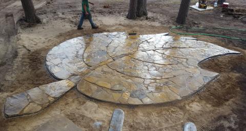 Bird's eye view of the leaf shaped outdoor classroom patio at Linda Ulland Memorial Gardens. Bird's eye view of the leaf shaped outdoor classroom patio at Linda Ulland Memorial Gardens.