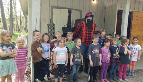 Paul Bunyan reads to Kindergarten students from Crosby Schools Paul Bunyan reads to Kindergarten students from Crosby Schools