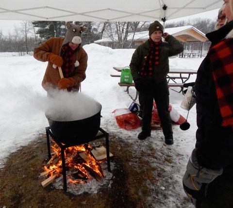 Taking turns stirring the winning soup in the Amateur division of 2014 SoupFest, the best winter time culinary contest around!
